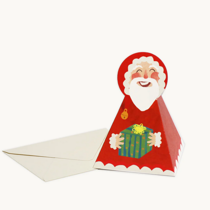 Card with a Santa Claus design holding a gift, featuring a white envelope. Hadley Paper Goods | Shop Fodder