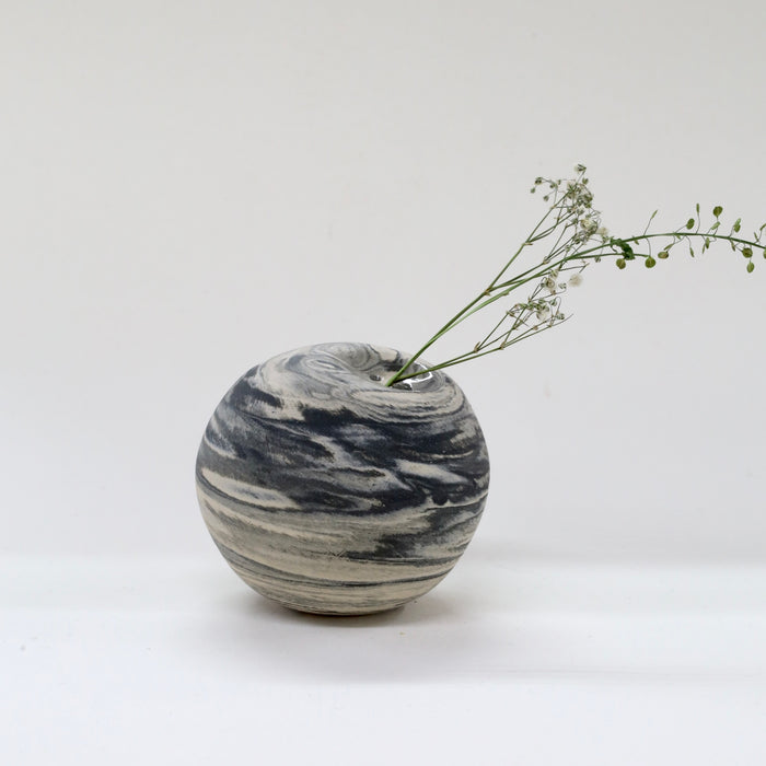 Marble-patterned vase with a branch on a white background | Janne Meijer | Shop Fodder