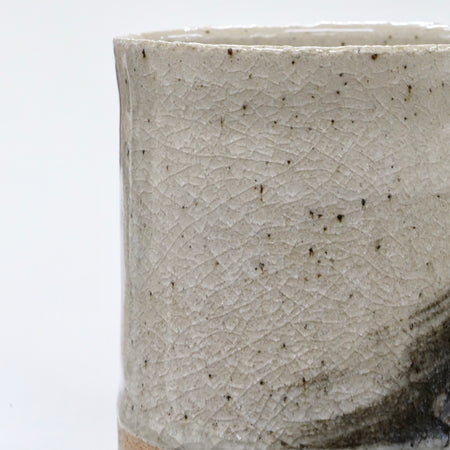 Close-up of a textured ceramic cup on a white background | Janne Meijer | Shop Fodder