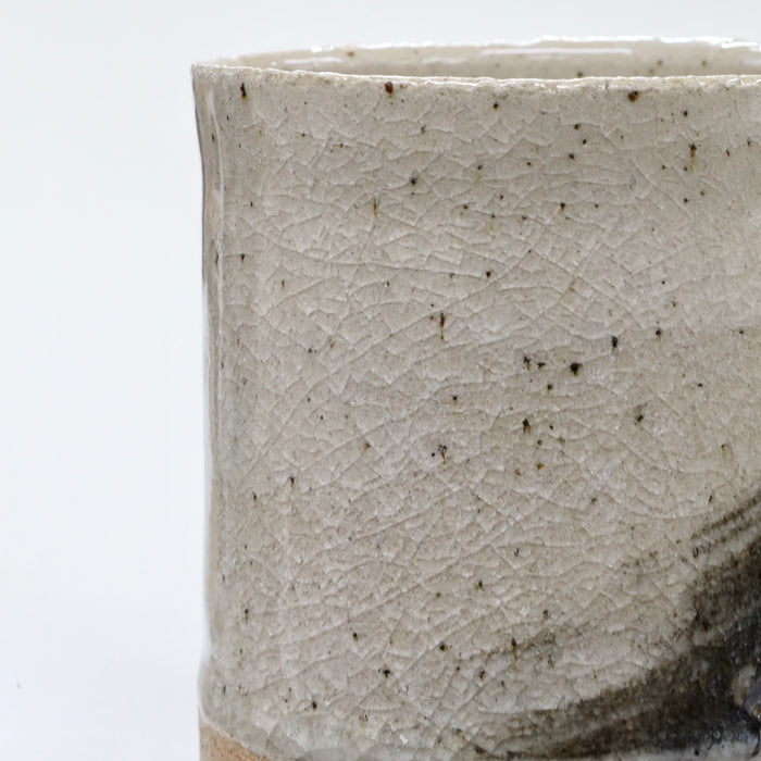 Close-up of a textured ceramic cup on a white background | Janne Meijer | Shop Fodder