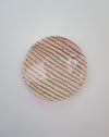 Round ceramic plate with striped pattern on a light gray background. Diddy Bowl | Jode Pankhurst | Shop Fodder