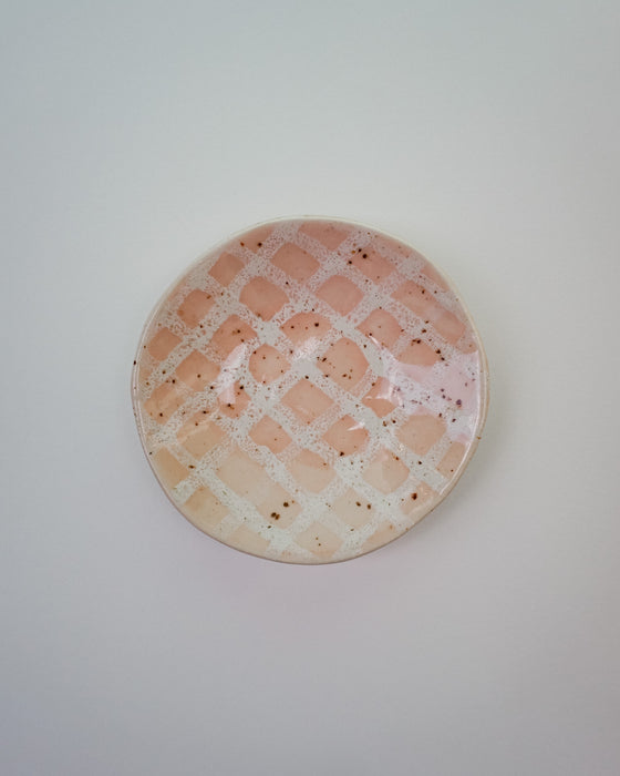 Round ceramic plate with a speckled pattern on a light gray background. Diddy Bowl | Jode Pankhurst | Shop Fodder