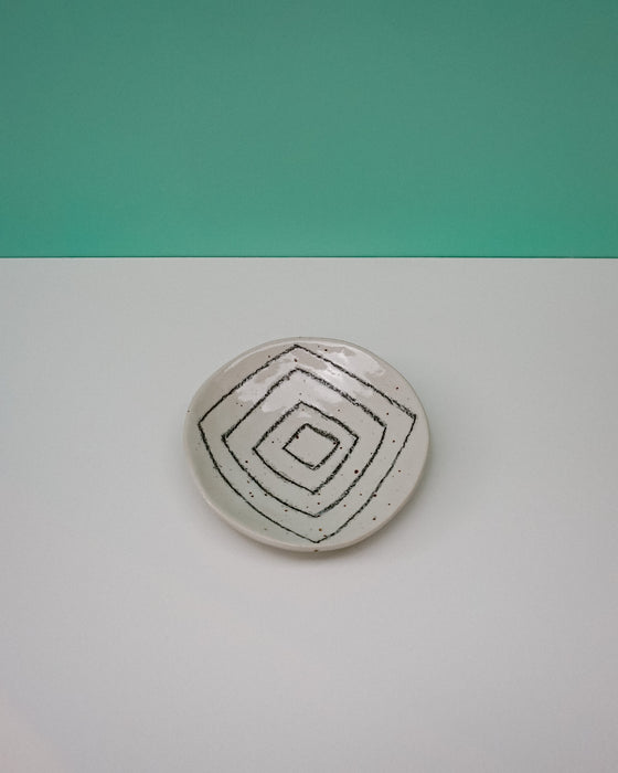 Round stone with concentric circle design on a gradient background. Diddy Bowl | Jode Pankhurst | Shop Fodder