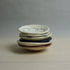 Stack of ceramic bowls with speckled patterns on a neutral background. Diddy Bowl | Jode Pankhurst | Shop Fodder