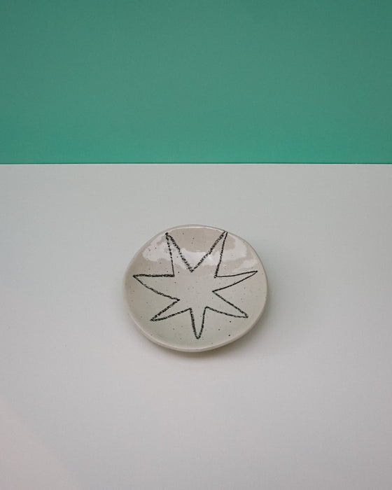 Round ceramic coaster with star design on a green and gray background. Diddy Bowl | Jode Pankhurst | Shop Fodder