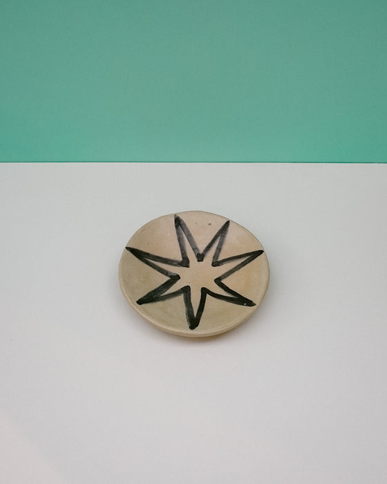 Ceramic disc with star design on a two-tone background. Diddy Bowl | Jode Pankhurst | Shop Fodder