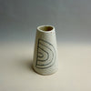 White ceramic vase with black spiral design on a gray background. Fluted Ceramic Vase | Jode Pankhurst | Shop Fodder