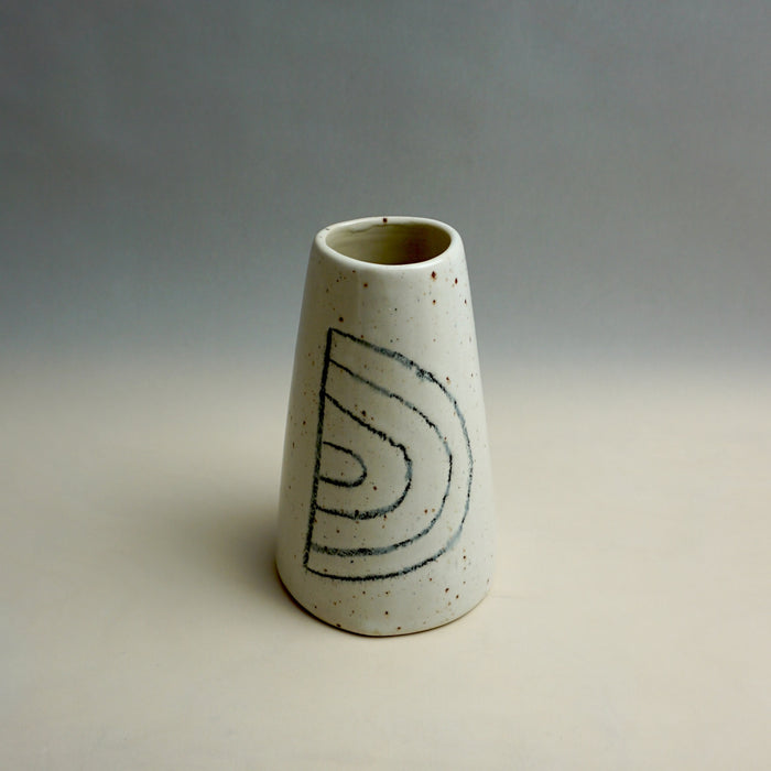 White ceramic vase with black spiral design on a gray background. Fluted Ceramic Vase | Jode Pankhurst | Shop Fodder