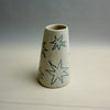 Cylindrical ceramic vase with star patterns on a plain background. Fluted Ceramic Vase | Jode Pankhurst | Shop Fodder