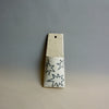 Ceramic pendant with star patterns on a grey background. Pocket Wall | Jode Pankhurst | Shop Fodder