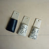 Four ceramic pendants with star designs on a beige surface. Pocket Wall | Jode Pankhurst | Shop Fodder