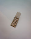 Cylindrical object with checkered pattern on a light gray background | Jode Pankhurst