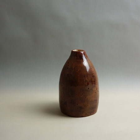 Brown ceramic vase on a gray background. Samara Collection | Jode Pankhurst | Shop Fodder