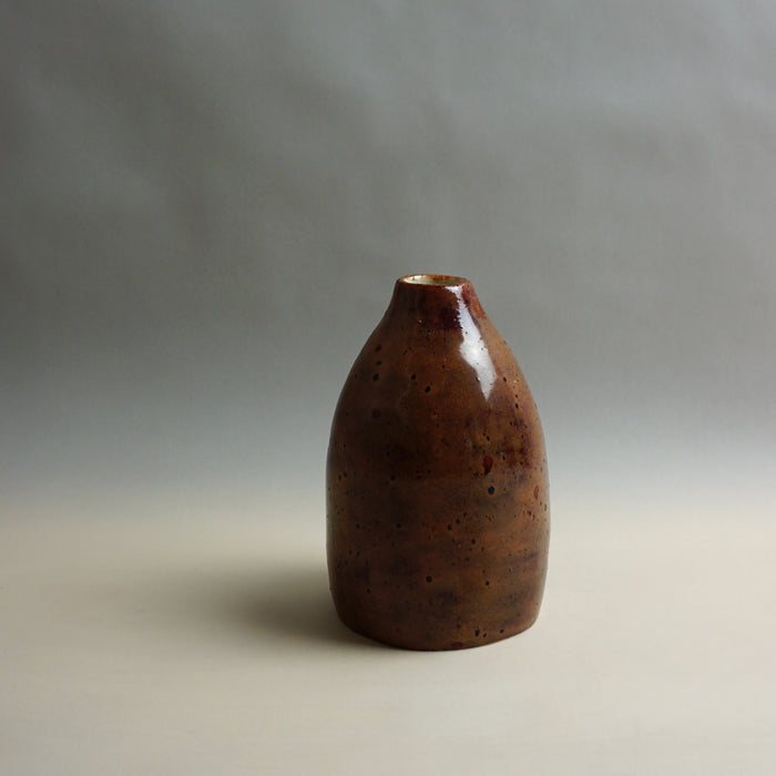 Brown ceramic vase on a gray background. Samara Collection | Jode Pankhurst | Shop Fodder