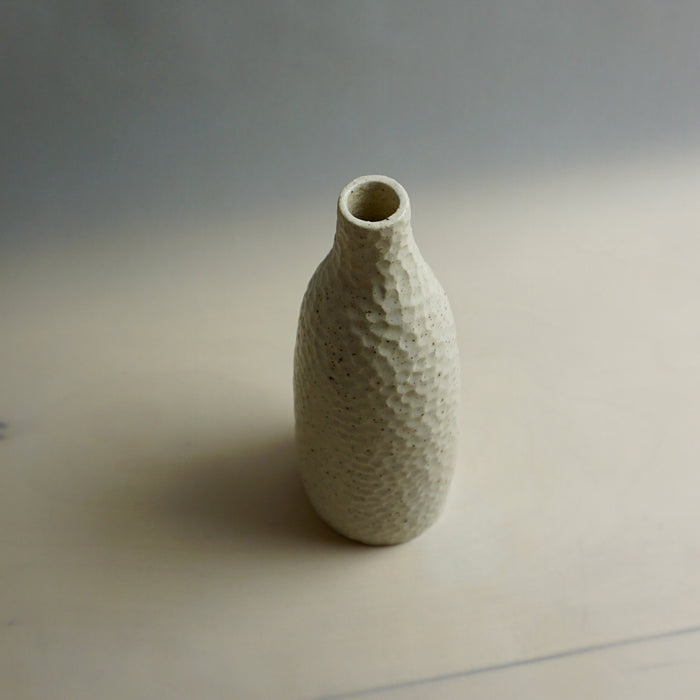 Textured ceramic vase on a plain background. Samara Collection | Jode Pankhurst | Shop Fodder