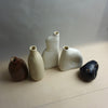 Five ceramic vases of different shapes and colors on a light surface with a neutral background. Samara Collection | Jode Pankhurst | Shop Fodder