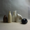 Five ceramic vases of different shapes and colors on a neutral background. Samara Collection | Jode Pankhurst | Shop Fodder