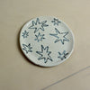Round ceramic plate with star patterns on a beige background. Trinket Dish | Jode Pankhurst | Shop Fodder
