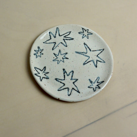 Round ceramic plate with star patterns on a beige background. Trinket Dish | Jode Pankhurst | Shop Fodder