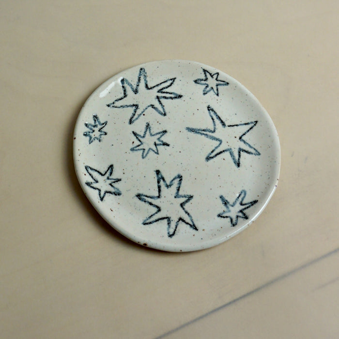 Round ceramic plate with star patterns on a beige background. Trinket Dish | Jode Pankhurst | Shop Fodder
