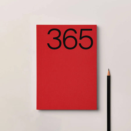 Red notebook with '365' on the cover next to a black pencil on a light grey background. Kinshipped Diary | Kinshipped | Shop Fodder