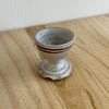 Small ceramic cup with a textured surface on a wooden surface. Lily Pearmain Ceramics | Shop Fodder