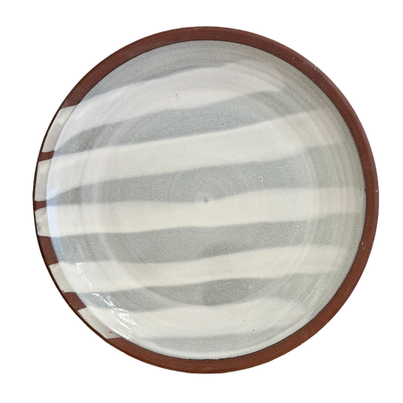 Ceramic plate with brown rim and gray and white striped interior on a white background. Lily Pearmain Ceramics | Shop Fodder