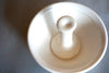 a white stoneware pestle & mortar