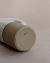 Lily Pearmain Ceramics | Doughnut Vase | Shop Fodder. The bottom of a clay vase with the maker mark of Lily Pearmain. 
