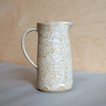 a speckled stoneware milk jug taken from the side. Speckled Milk Jug | Lily Pearmain | Shop Fodder