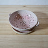 Mae Ceramics handmade colander and pink glaze in the smaller size. 