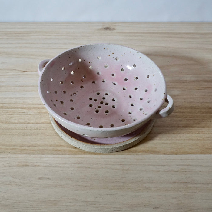 Mae Ceramics handmade colander and pink glaze in the smaller size. 