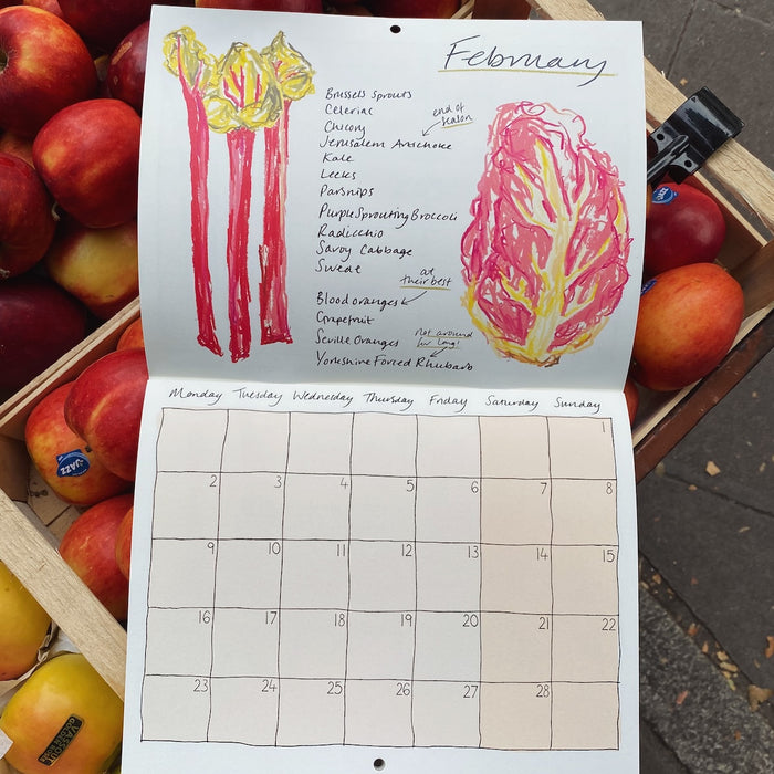 Calendar for February with hand-drawn vegetables surrounded by a crate of apples. Emma Cantley | Mainly Breakfast | Shop Fodder