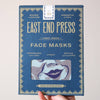 Hand holding a box of East End Press face masks against a light background. Masks | East End Press | Shop Fodder