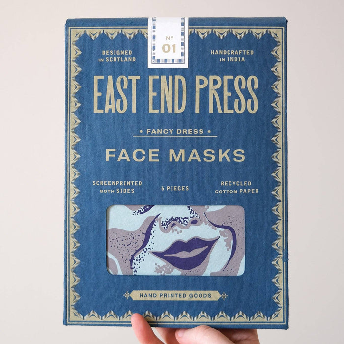 Hand holding a box of East End Press face masks against a light background. Masks | East End Press | Shop Fodder