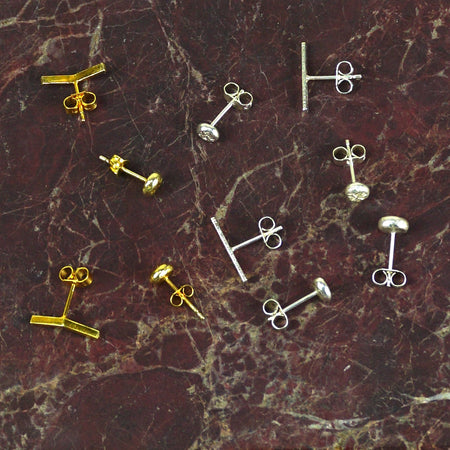 Gold and silver earring studs on a marbled surface | Mix & Match Studs | Scarlett French | Fodder