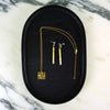 Gold necklace and earrings on a black jewelry box with a marble background.  | Scarlett Cohen French | Shop Fodder