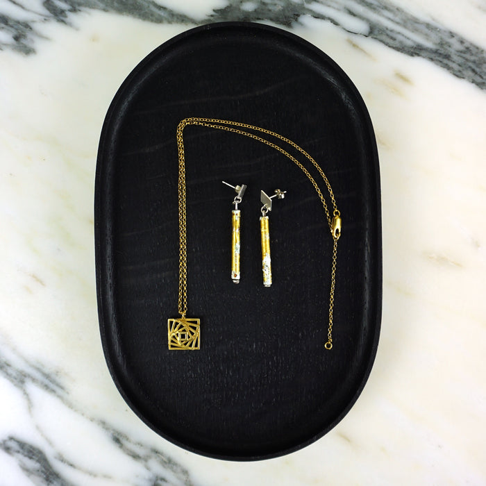 Gold necklace and earrings on a black jewelry box with a marble background.  | Scarlett Cohen French | Shop Fodder
