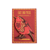 Red wooden ornament with bird design on a red background, featuring 'East End Press' branding. | Shop Fodder