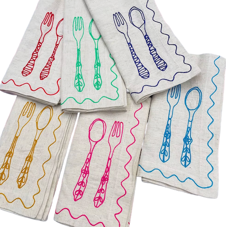Set of napkins with colorful cutlery designs on a white background. Embroidered Linen Napkins | See & Quin | Shop Fodder