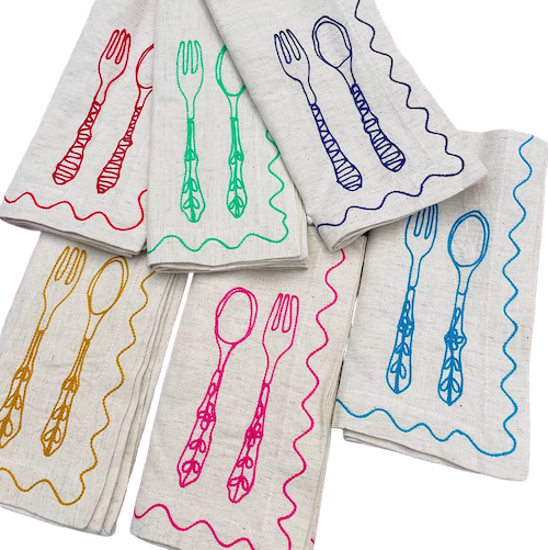 Set of napkins with colorful cutlery designs on a white background. Embroidered Linen Napkins | See & Quin | Shop Fodder