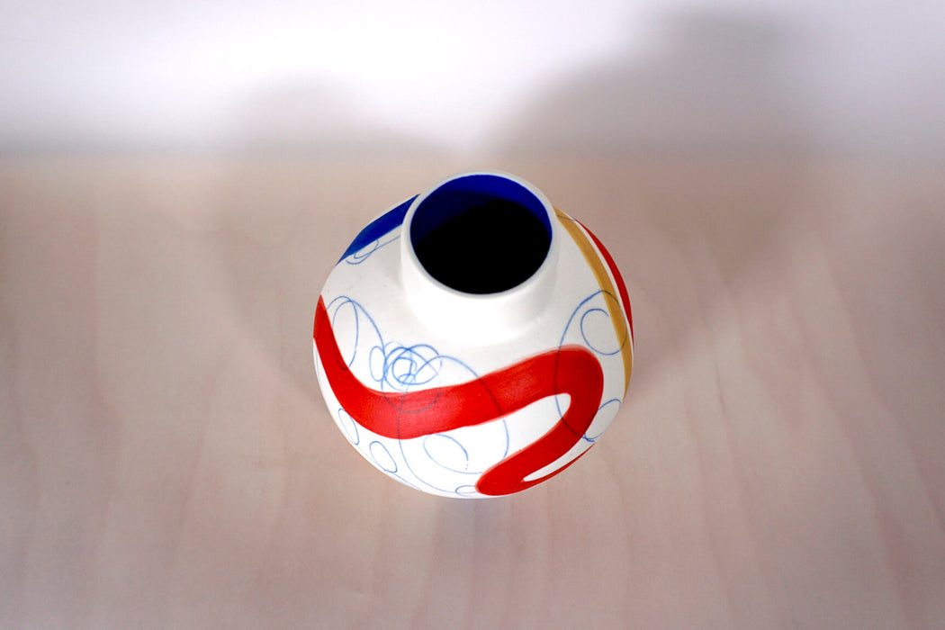 detail of the neck of a handmade vase with abstract pattern. 