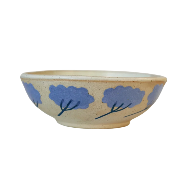 Ceramic bowl with blue floral designs on a beige background. Sophie Alda Yarrow Bowl | Shop Fodder