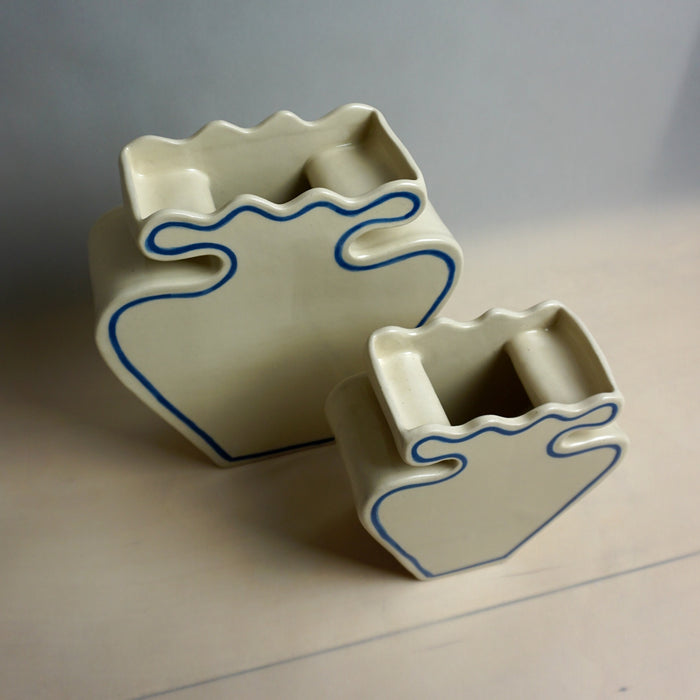 Two ceramic planters with blue decorative lines on a neutral background | Studio ERS | Shop Fodder
