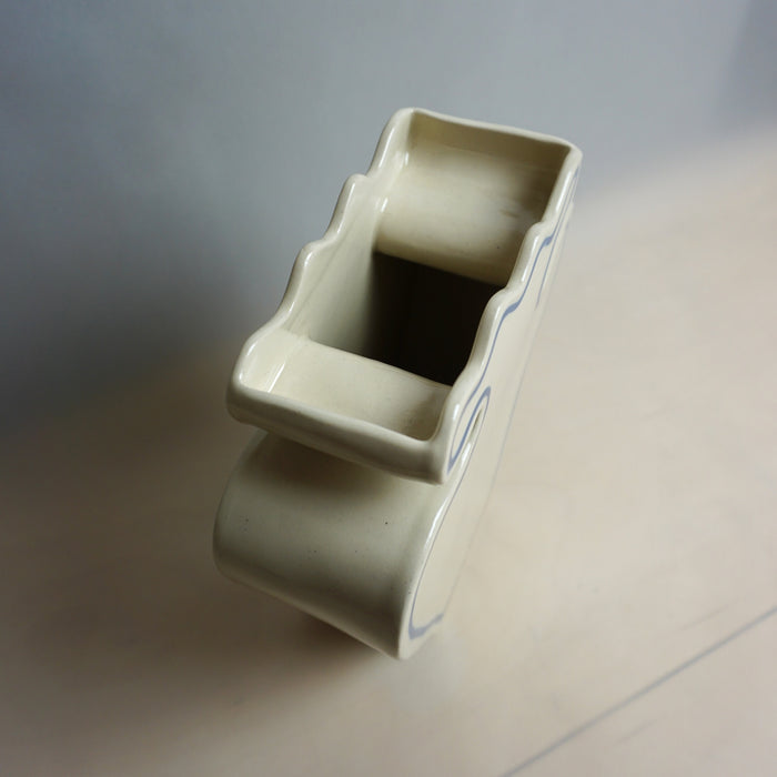 White ceramic object with a rectangular top on a light gray background | Studio ERS | Shop Fodder