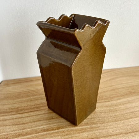 Brown ceramic vase on a wooden surface with a white background. Studio ERS | Ceramic Vase | Shop Fodder