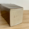 Rectangular ceramic vase base with 'ERS' branding on a wooden surface. Studio ERS | Ceramic Vase | Shop Fodder