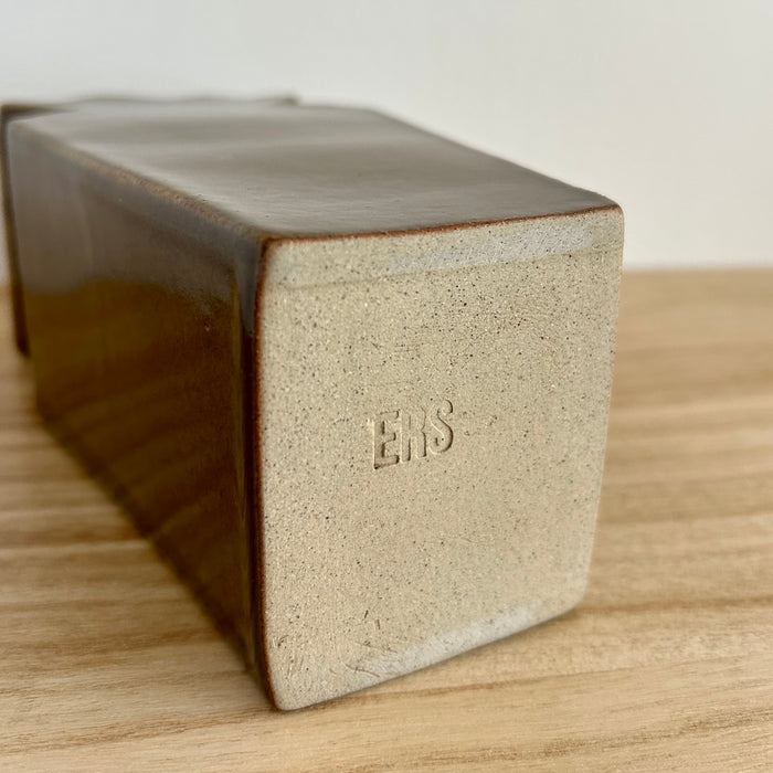 Rectangular ceramic vase base with 'ERS' branding on a wooden surface. Studio ERS | Ceramic Vase | Shop Fodder