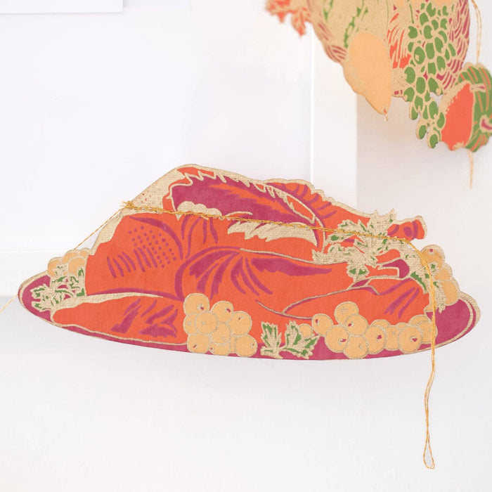 Decorative headband with floral pattern on a white background. Thanksgiving Handprinted Garland | East End Press | Shop Fodder