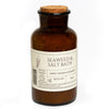 Brown glass bottle with cork lid labeled 'Seaweed & Salt Bath' on a white background | Handmade Seaweed Bath Salts | WASI Seaweed | Shop Fodder
